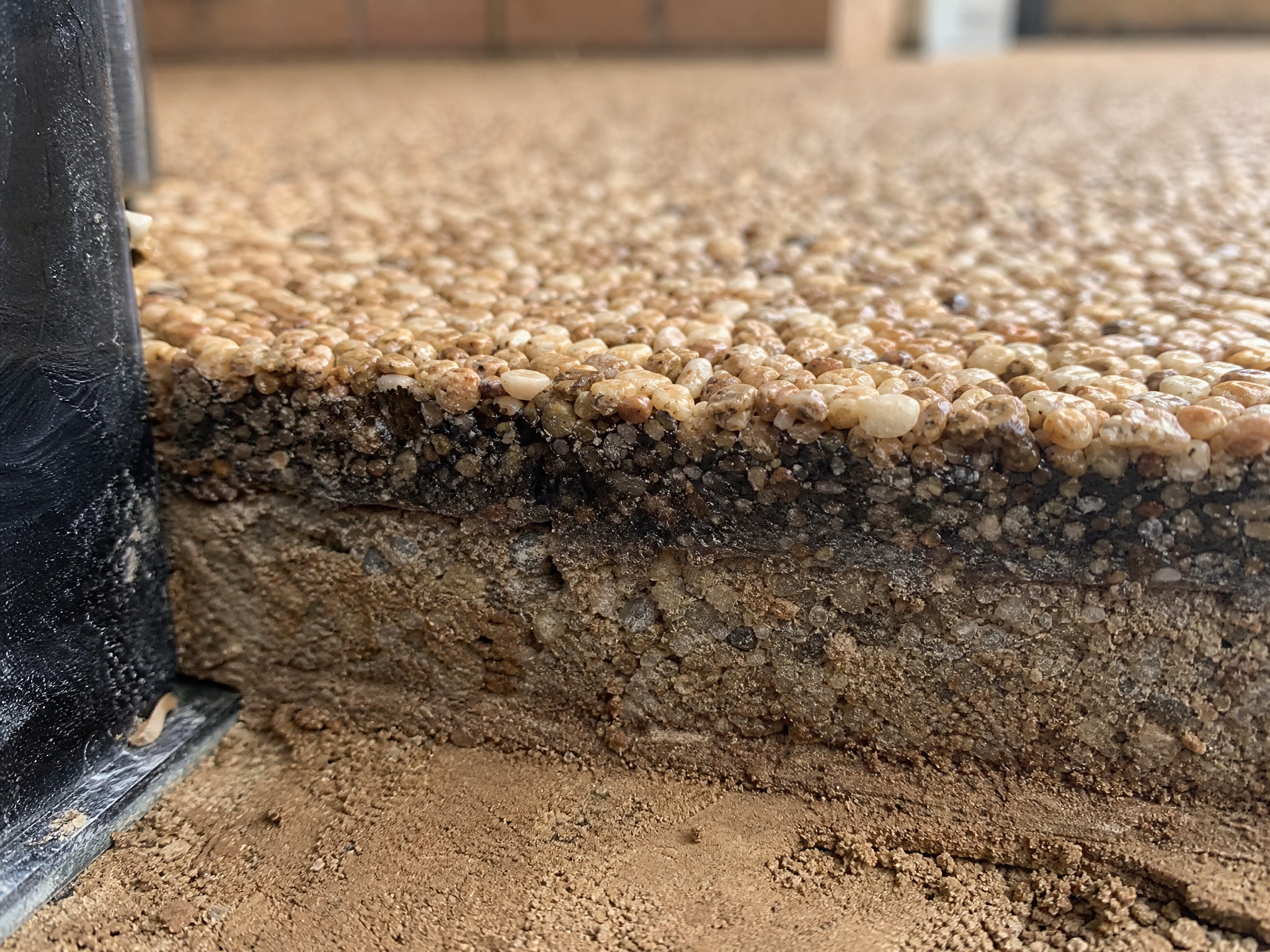 Close-up detail of materials and technique used in commercial resin surfacing — showing quality