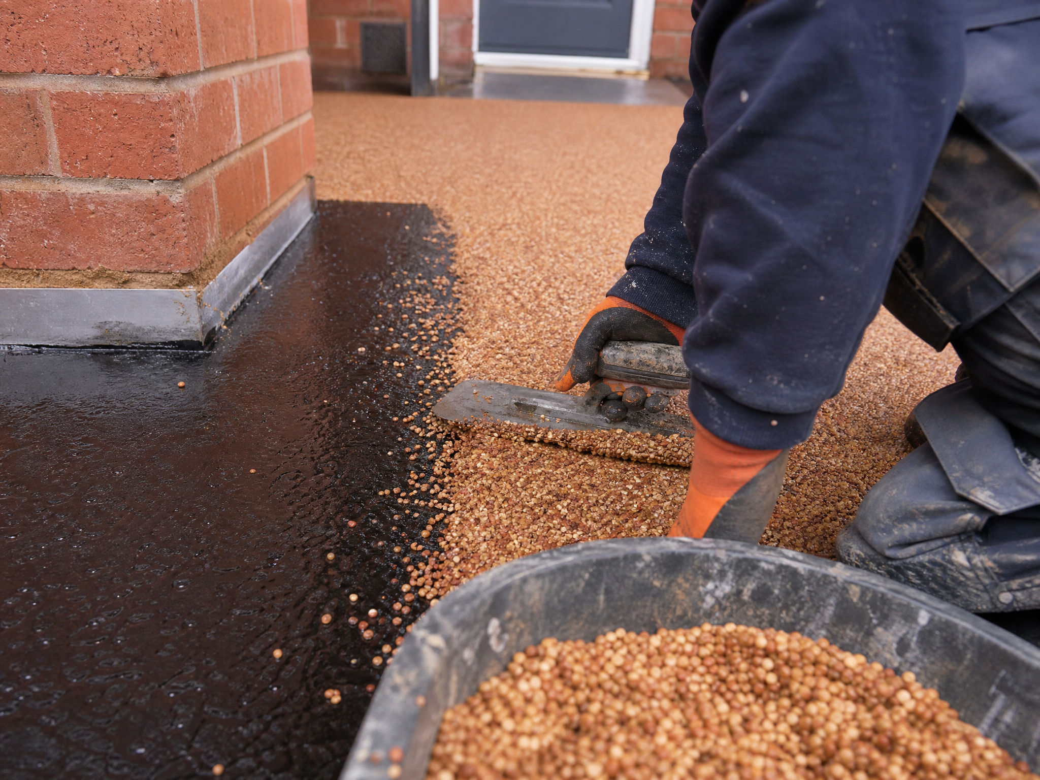 Professional installer carrying out commercial resin surfacing in a British residential property