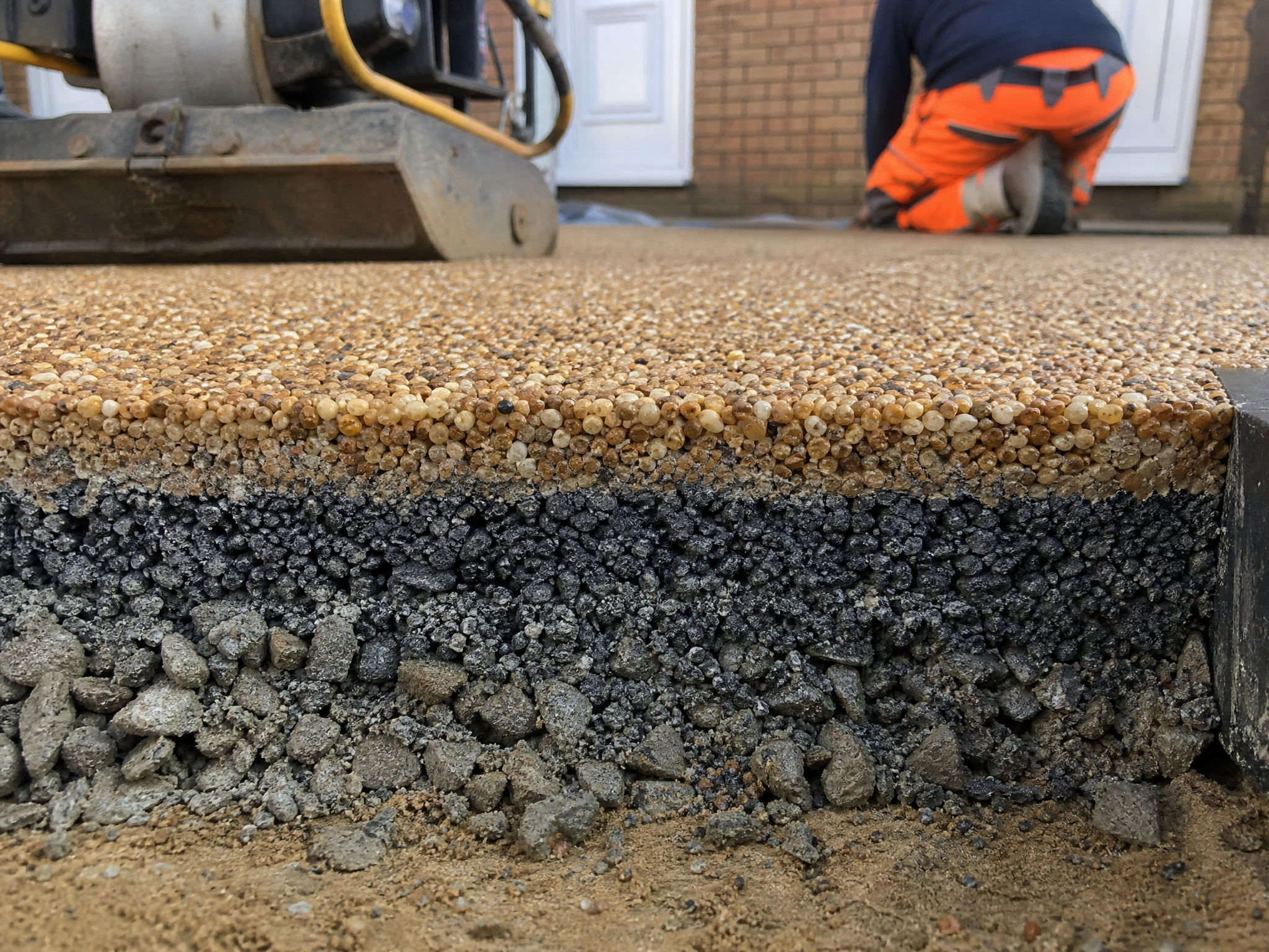 Close-up detail of materials and technique used in resin bound driveways — showing quality