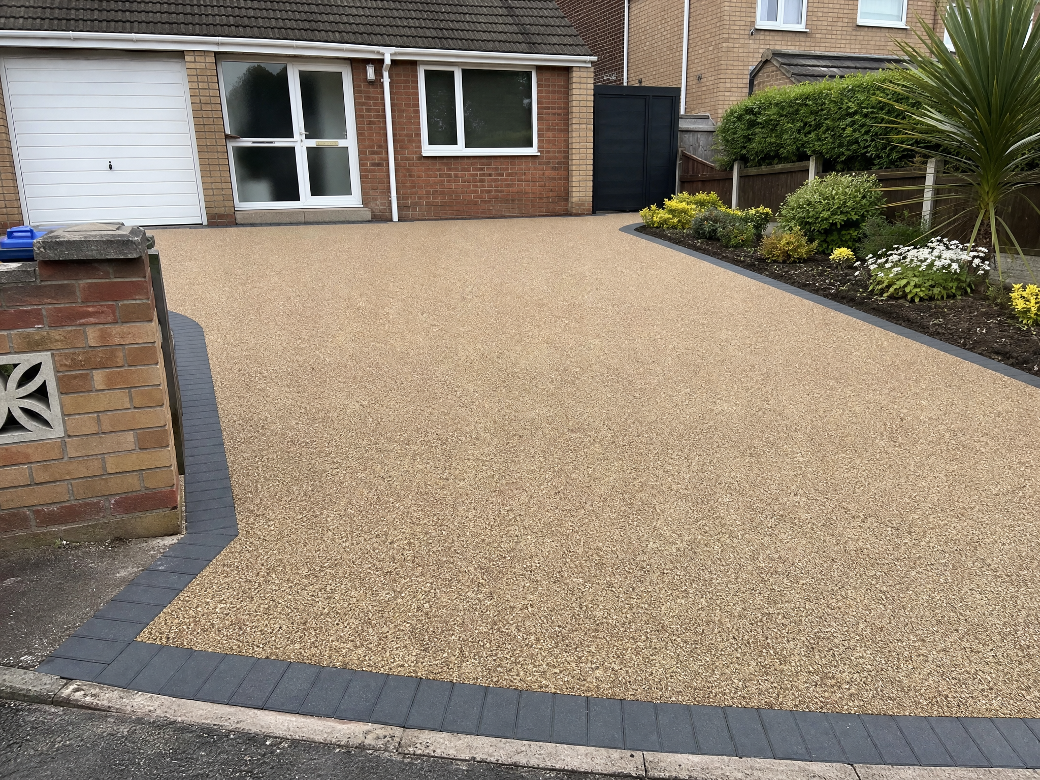 Completed resin driveway repairs & cleaning showing professional quality workmanship in a British home