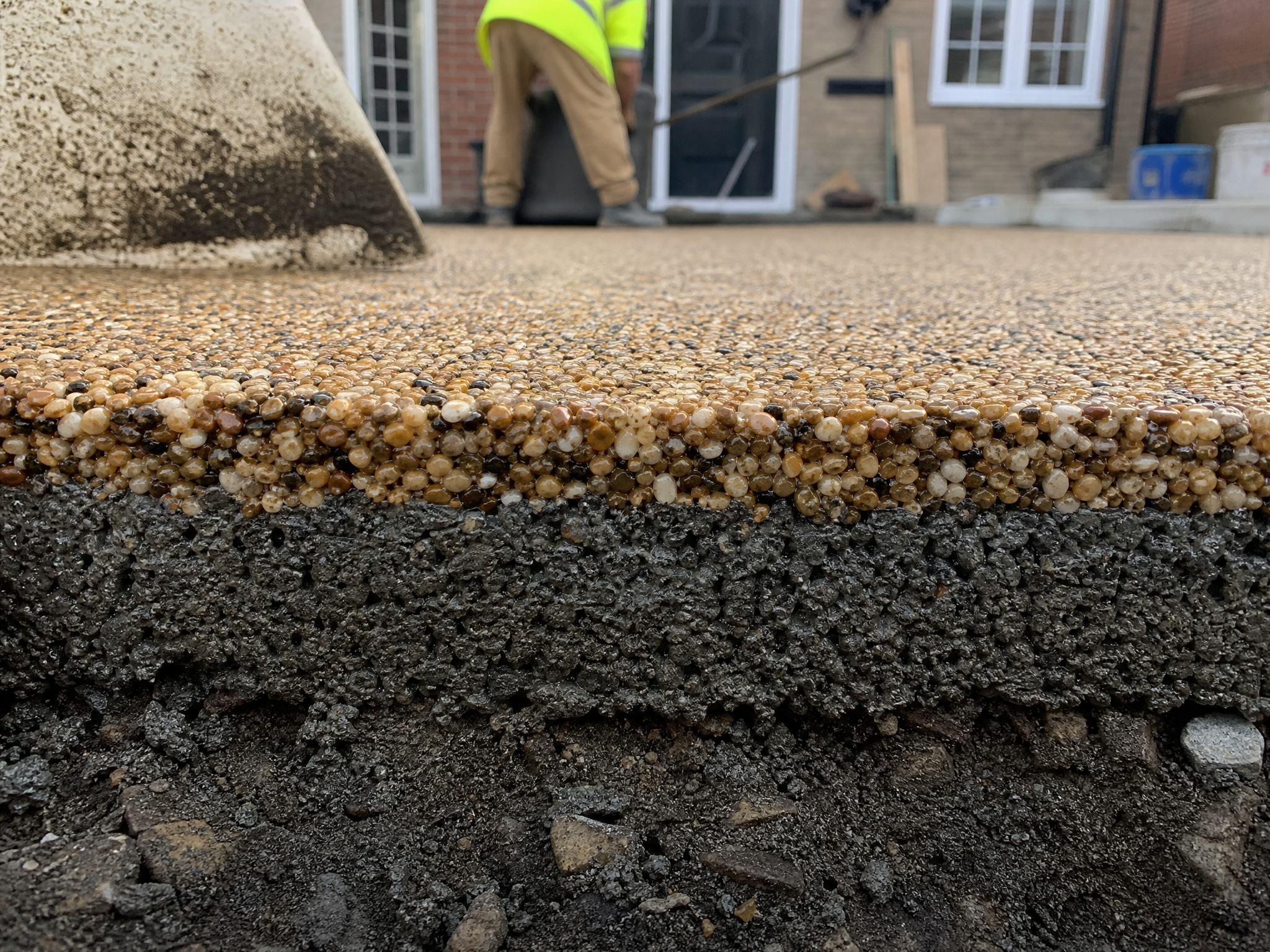 Close-up detail of materials and technique used in resin patios — showing quality
